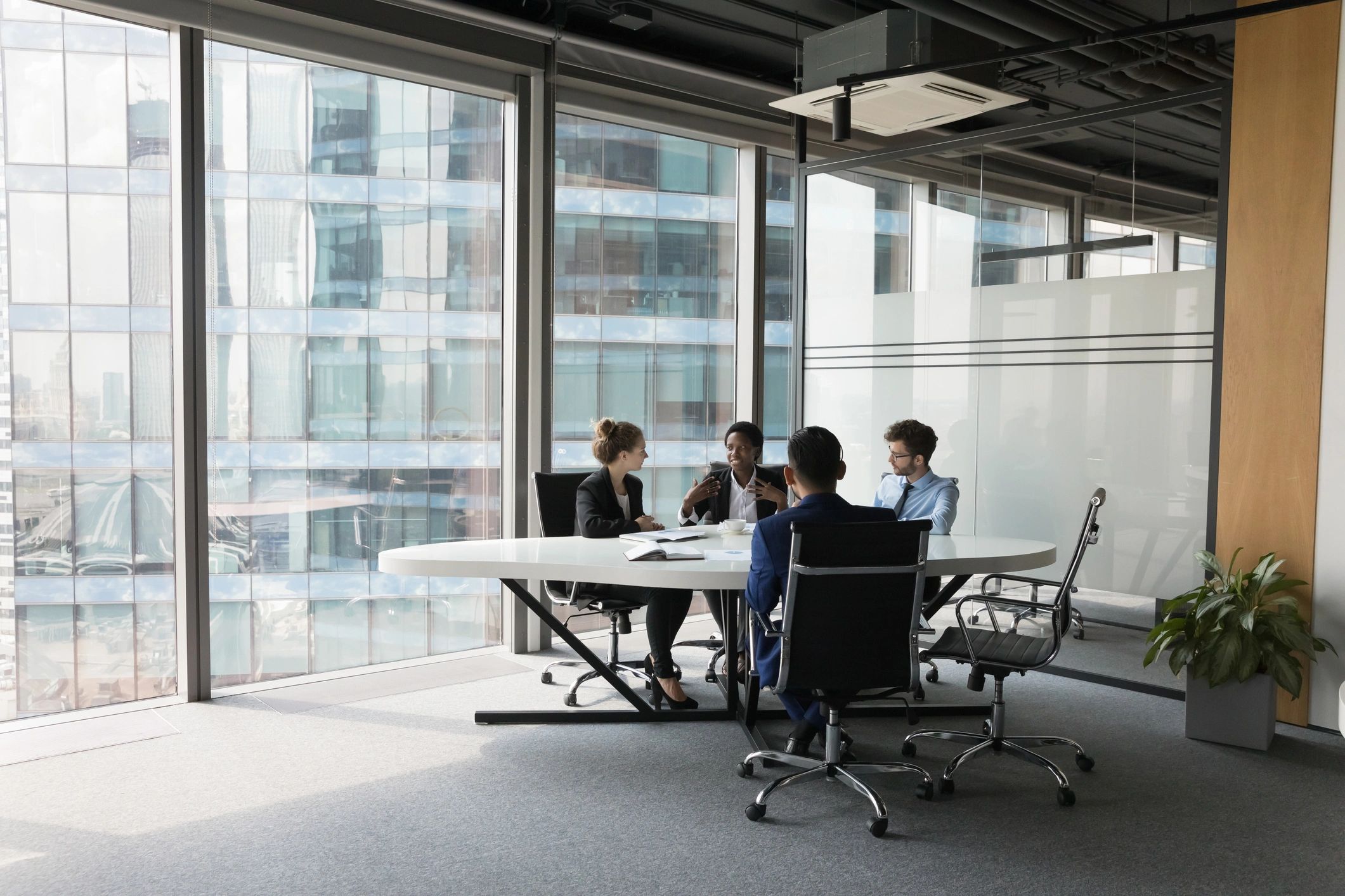 Diverse professional team meeting in a modern office