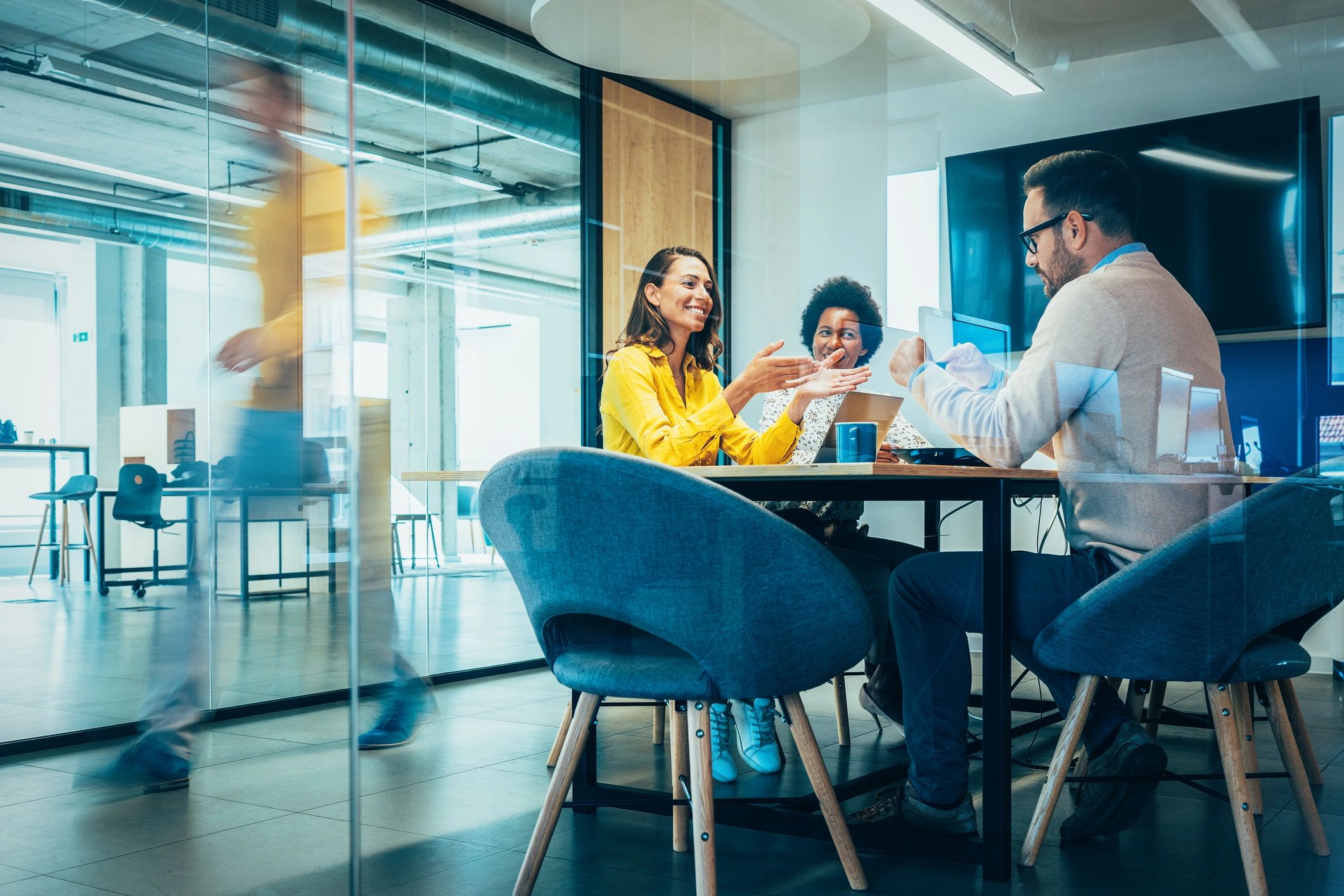 Professionals collaborating in a busy office environment