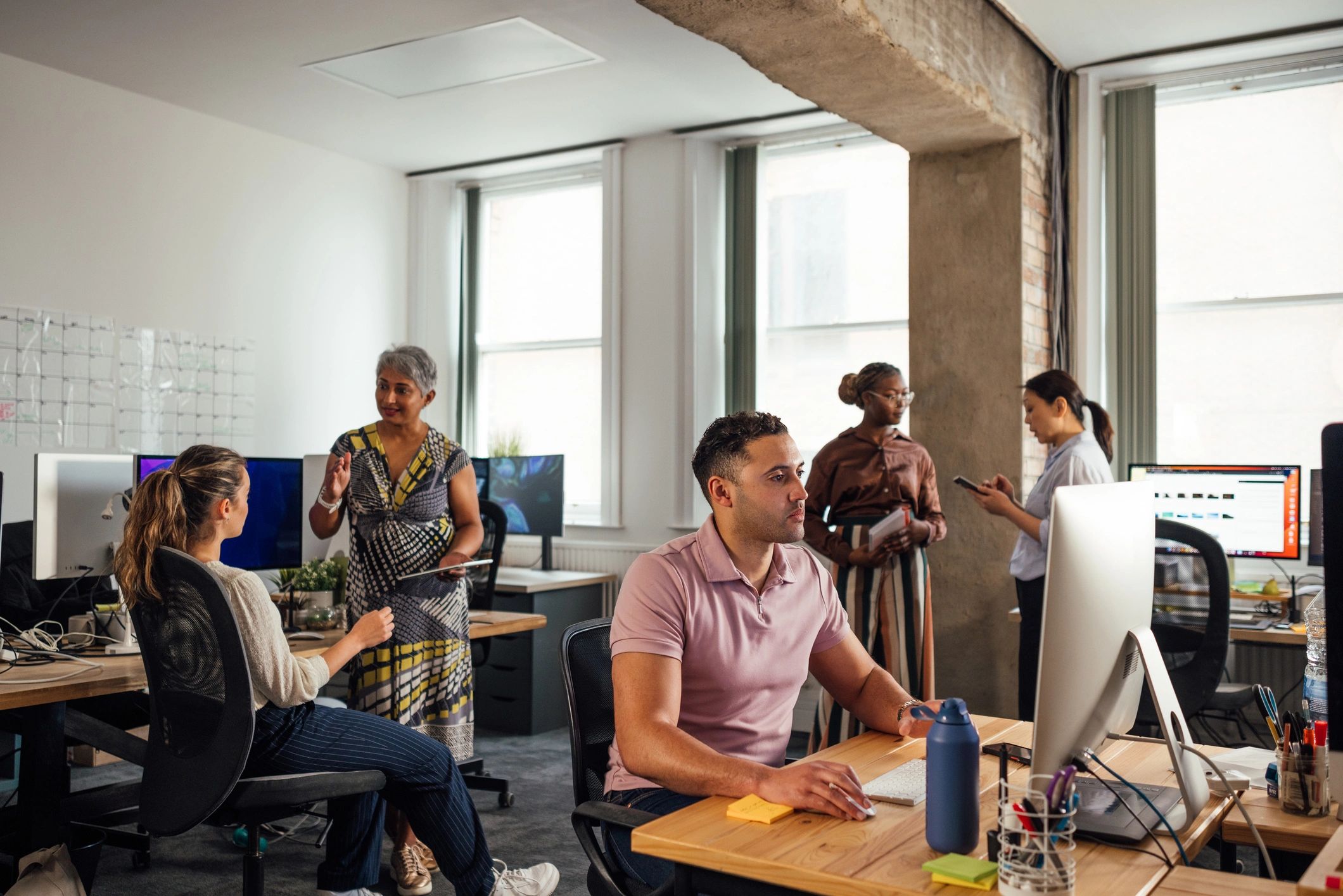Team collaborating in an office for staff augmentation