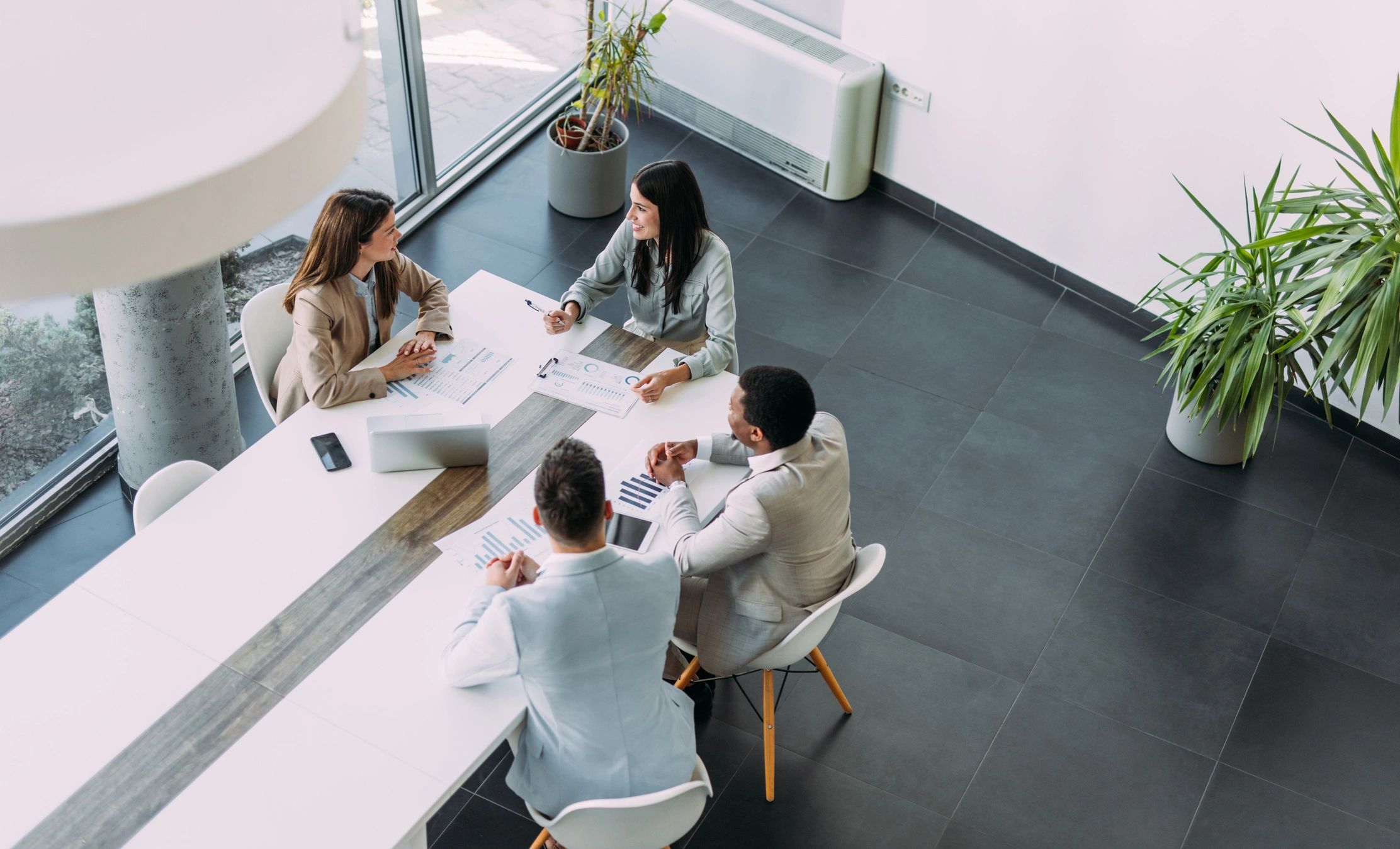 Corporate team meeting around a boardroom table