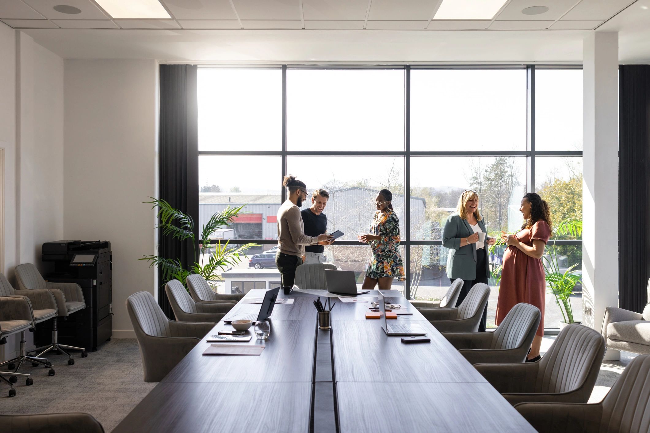 Business colleagues discussing work in a modern office