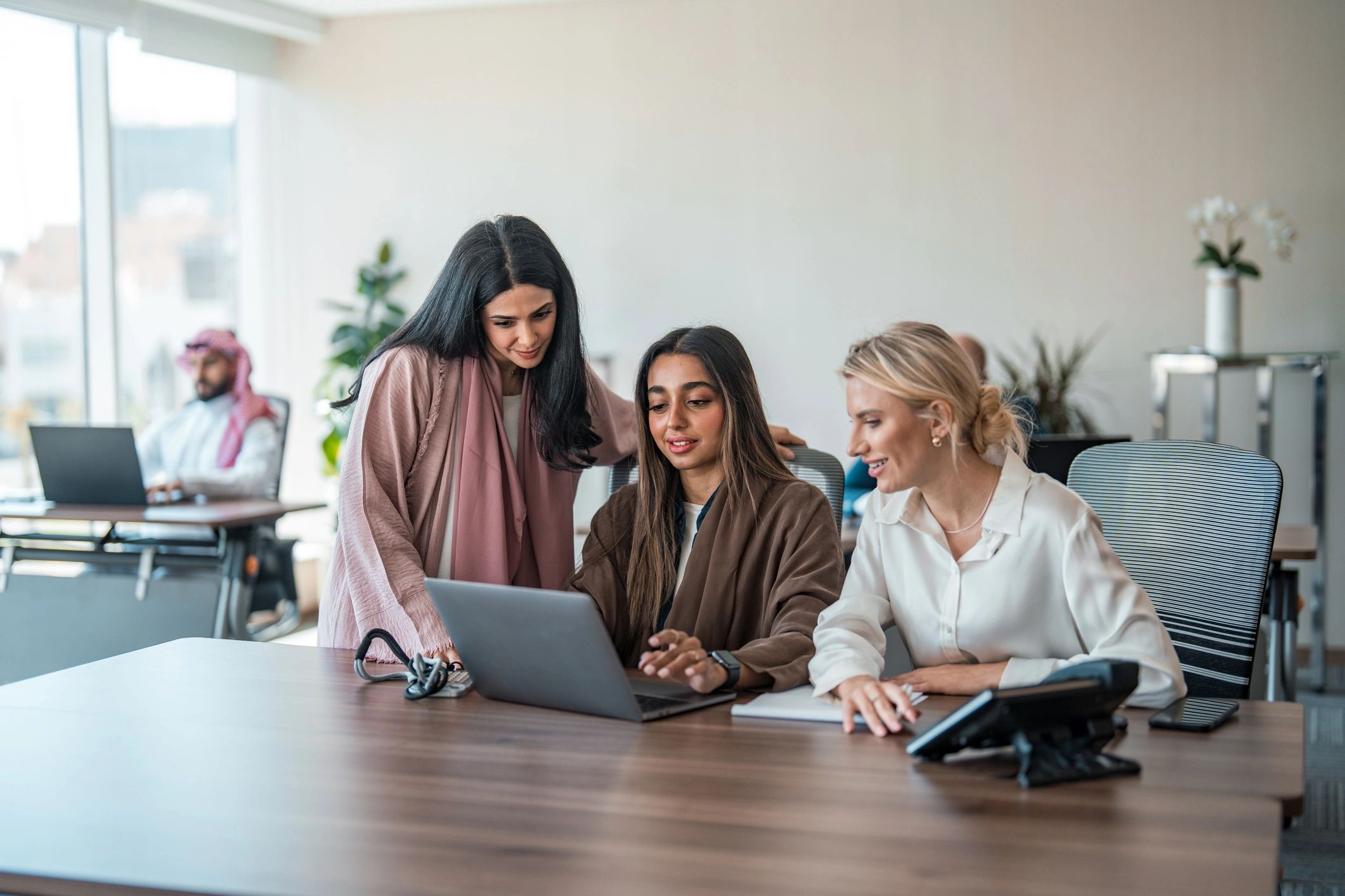 Professionals collaborating at a conference table